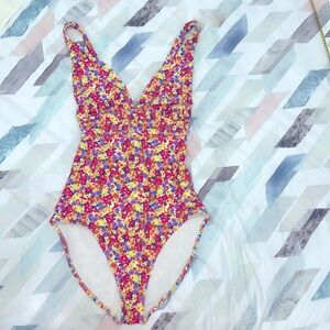 Pink, purple and yellow floral one piece bathing suit